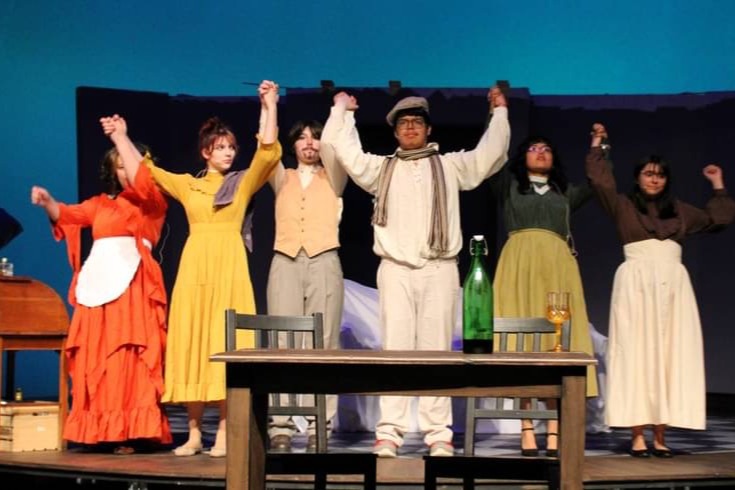High school students thanking the audience after performing their play.