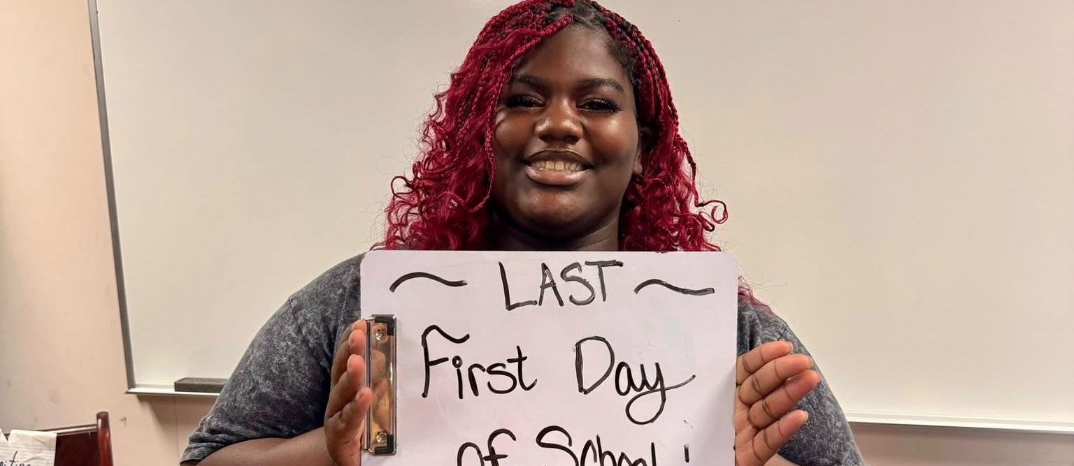 Student Holding Sign Picture
