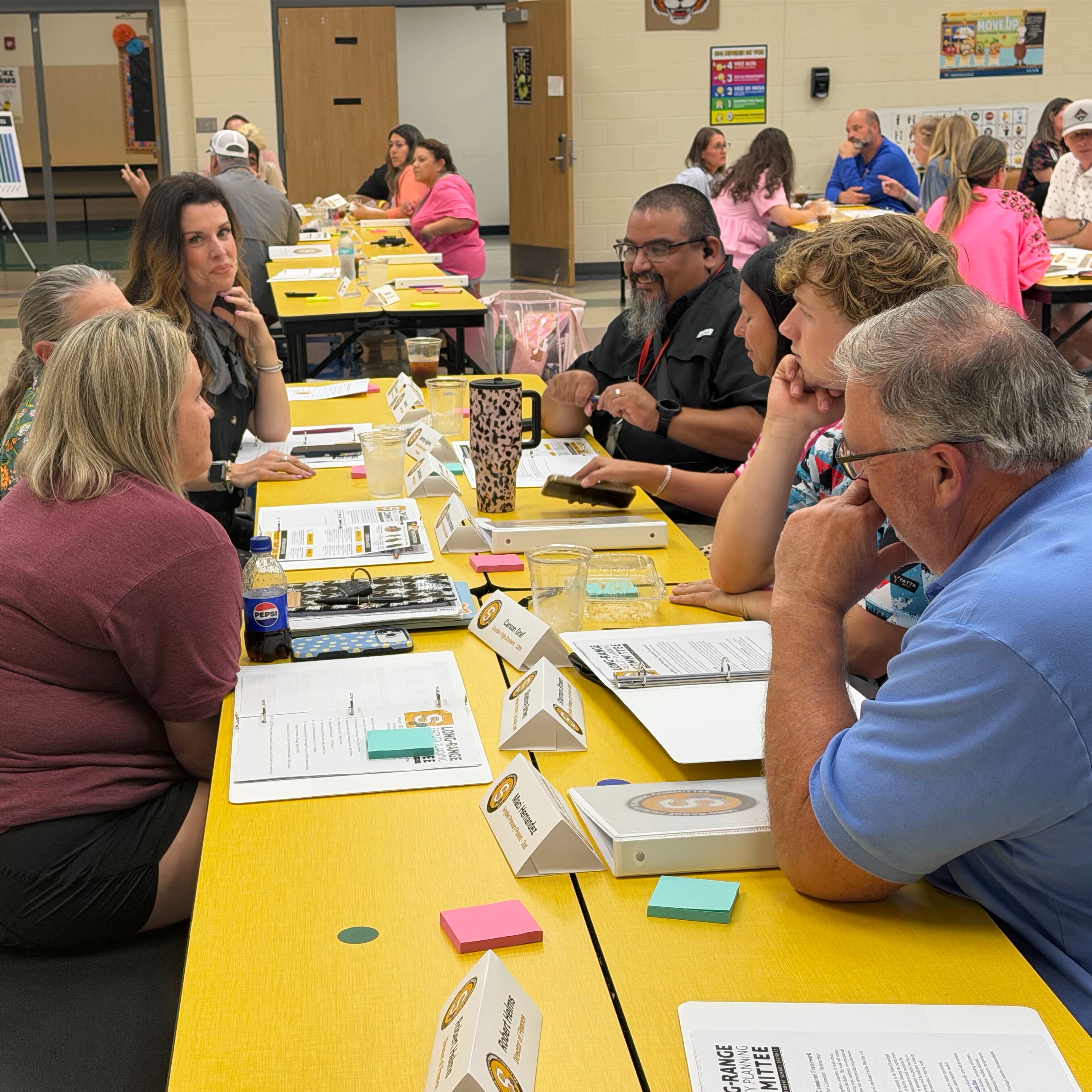 Committee members converse during first meeting