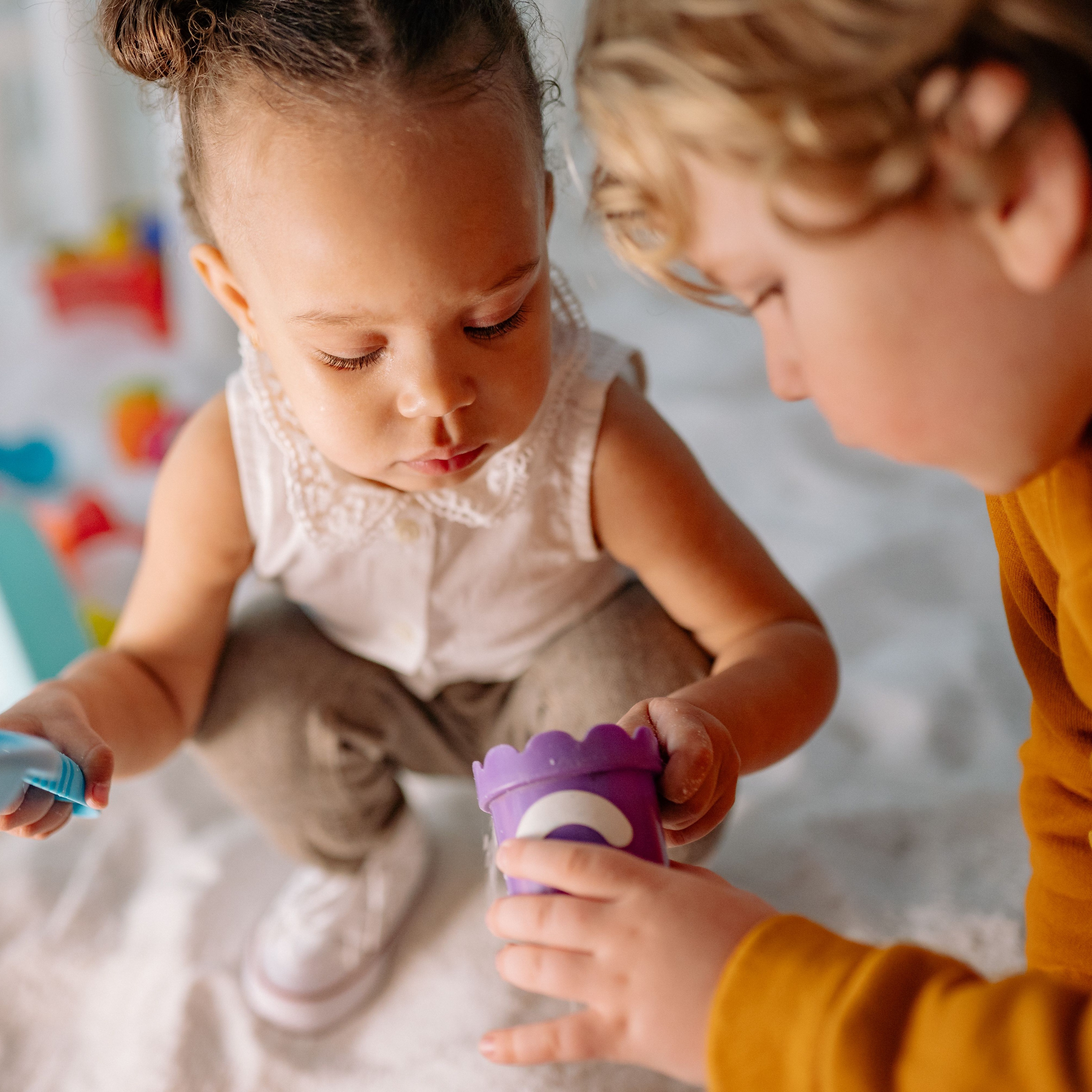 Two small children playing together