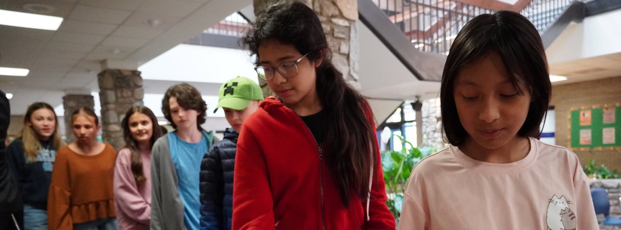 students getting food samples from a table