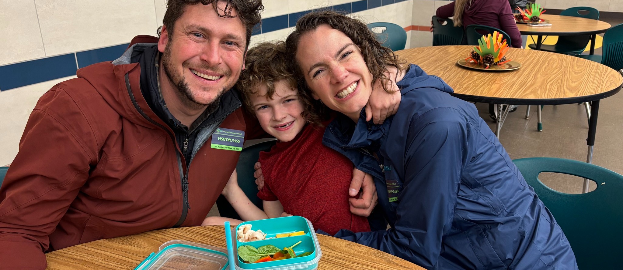 Chenal MAR Slider of parents visiting a child during lunch.