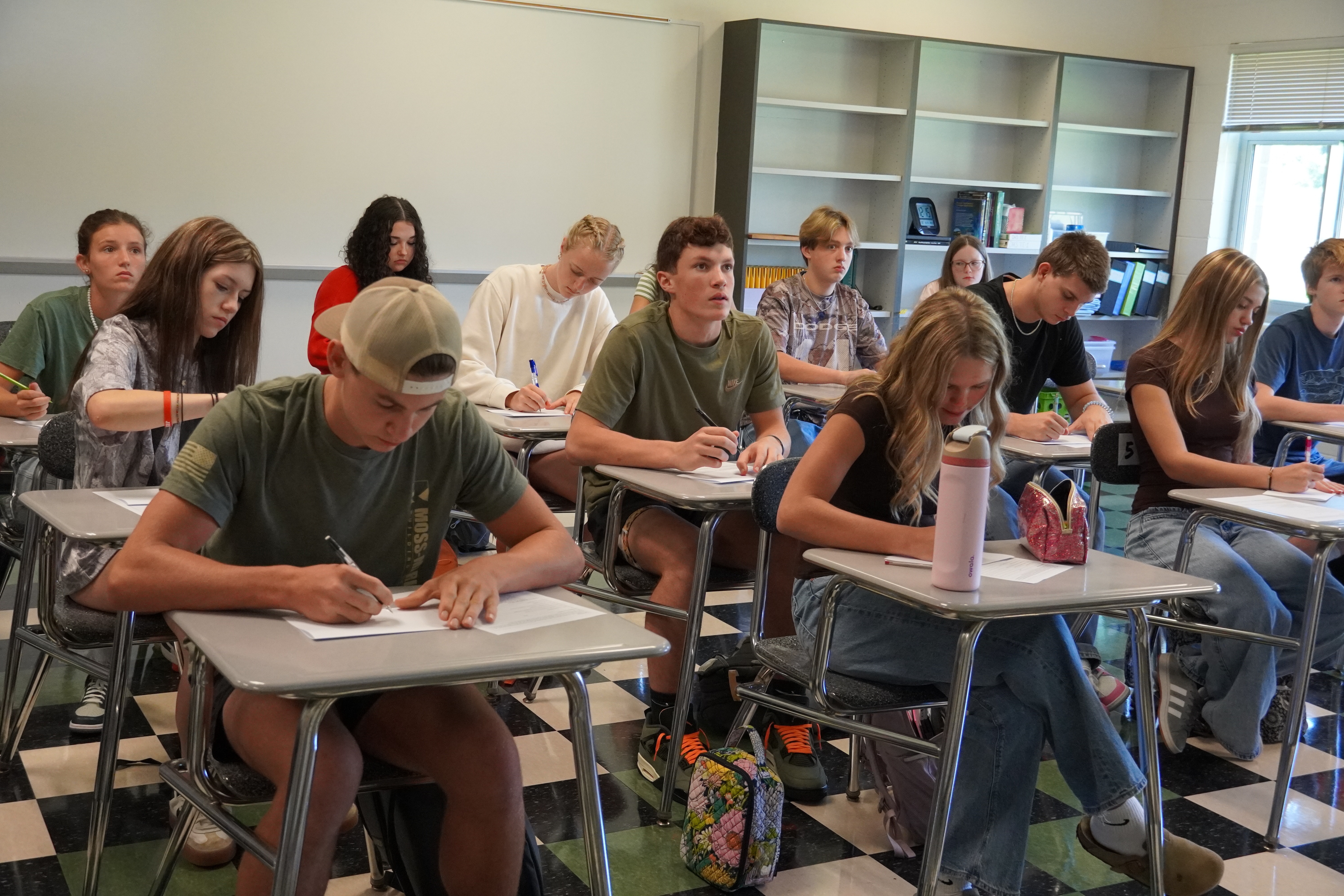 students at desk in a classroom