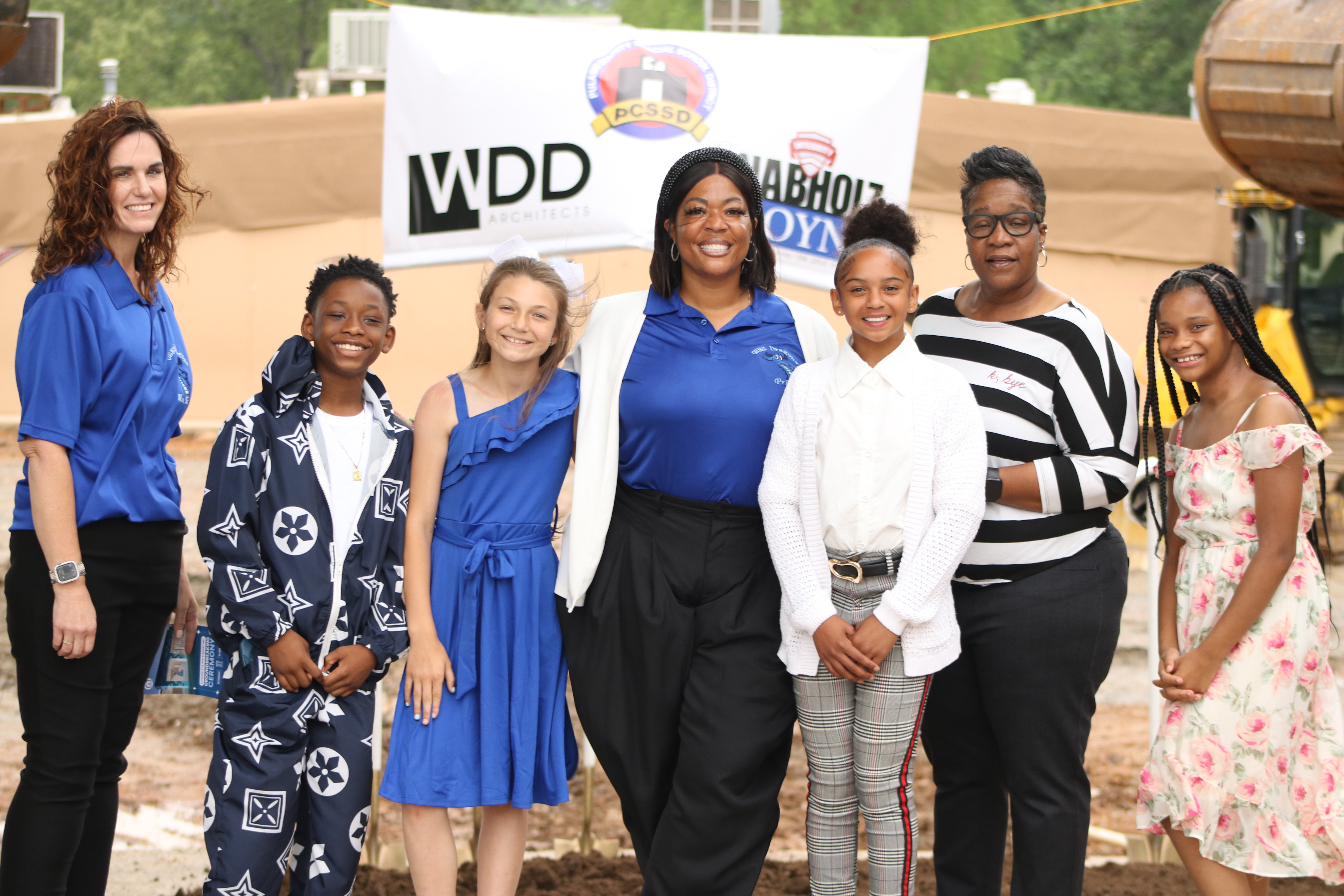 Principal with students at groundbreaking