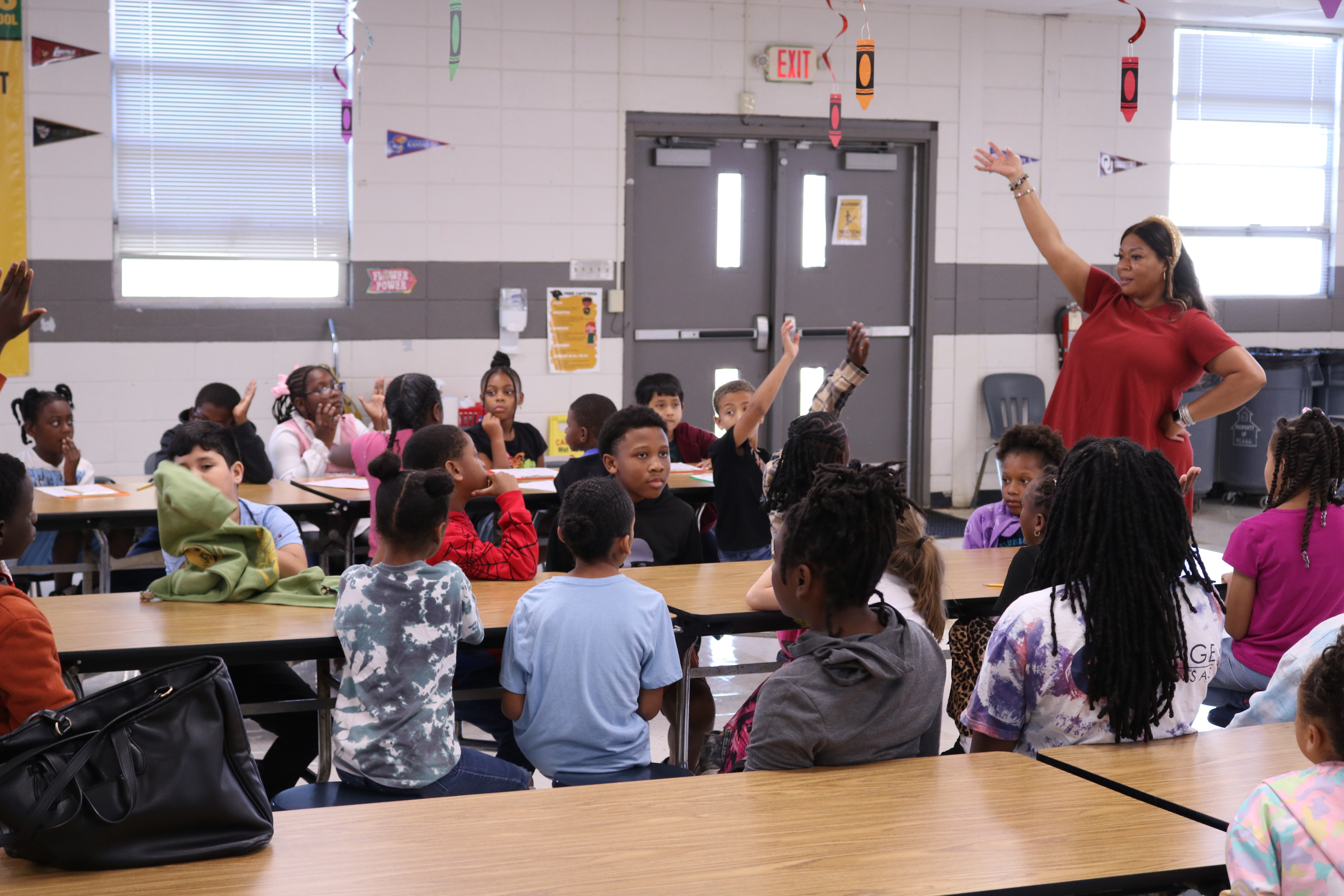 Principal Evans speaks to students in the cafeteria