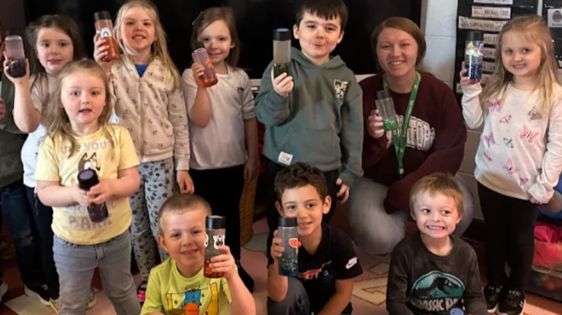 GSRP students holding up water bottles to support proper hydration as part of the GOISD wellness campaign.