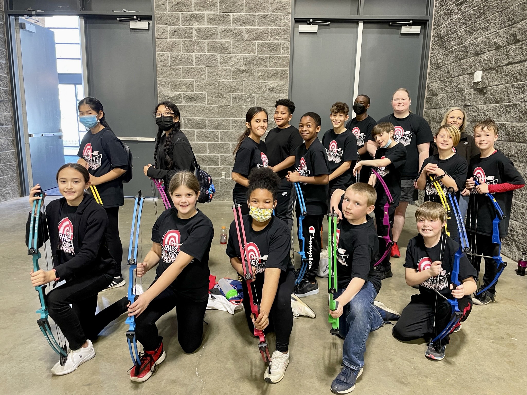 students with archery bows