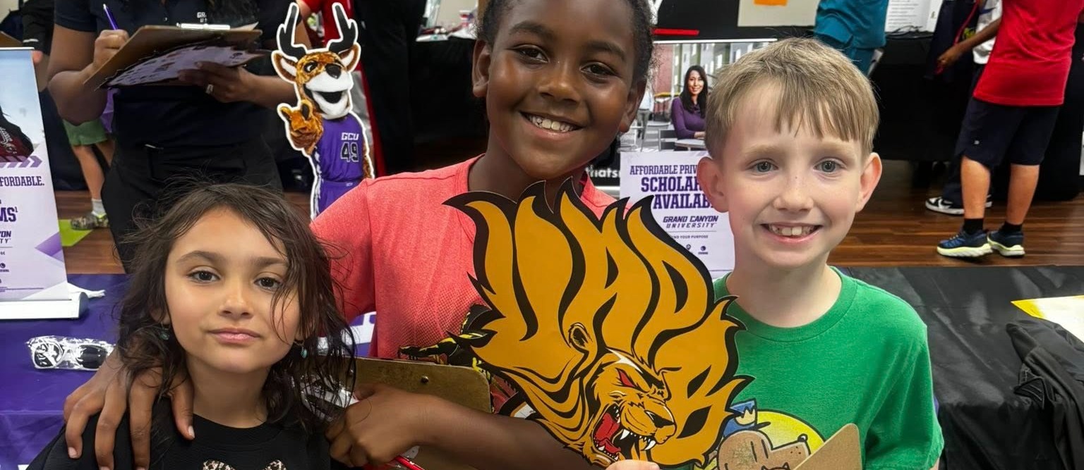 Students side by side smiling