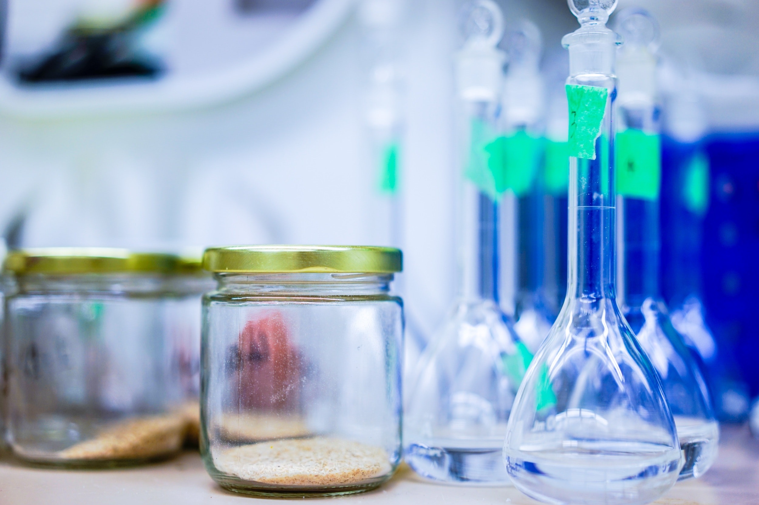 A close up photo of various glass jars in a science classroom
