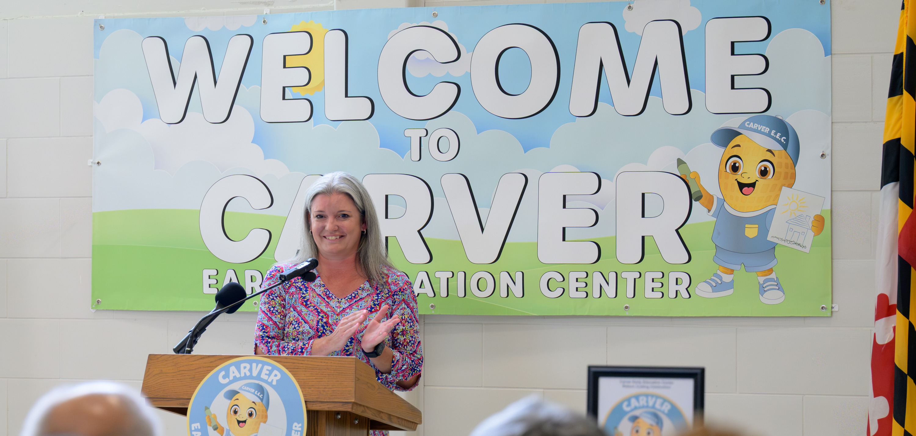 Principal welcoming the community to Carver EEC at the ribbon cutting event
