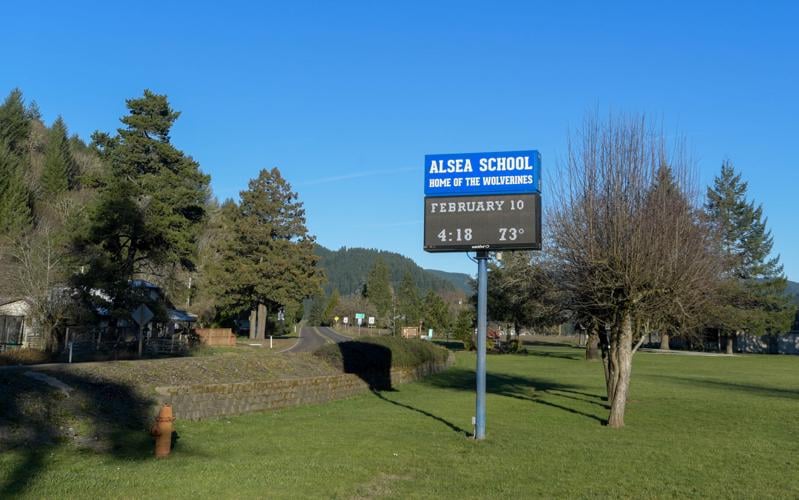field with school sign in it