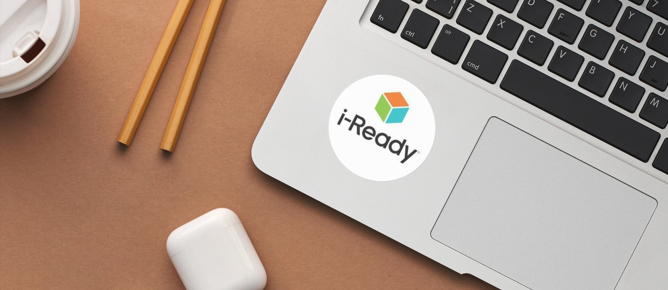 laptop with round sticker on bottom reading i-ready