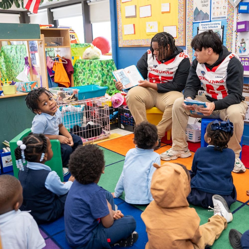 high school students reading to early childhood children