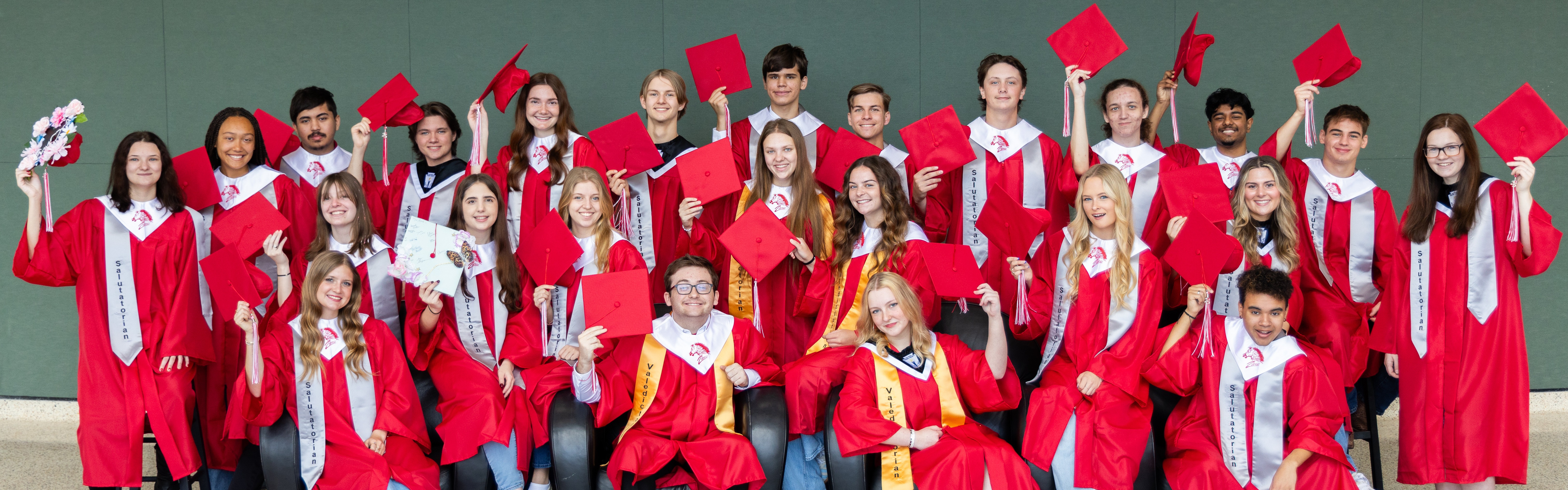 students in graduation caps and gowns