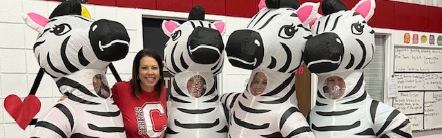 principal with 3 blow up zebras