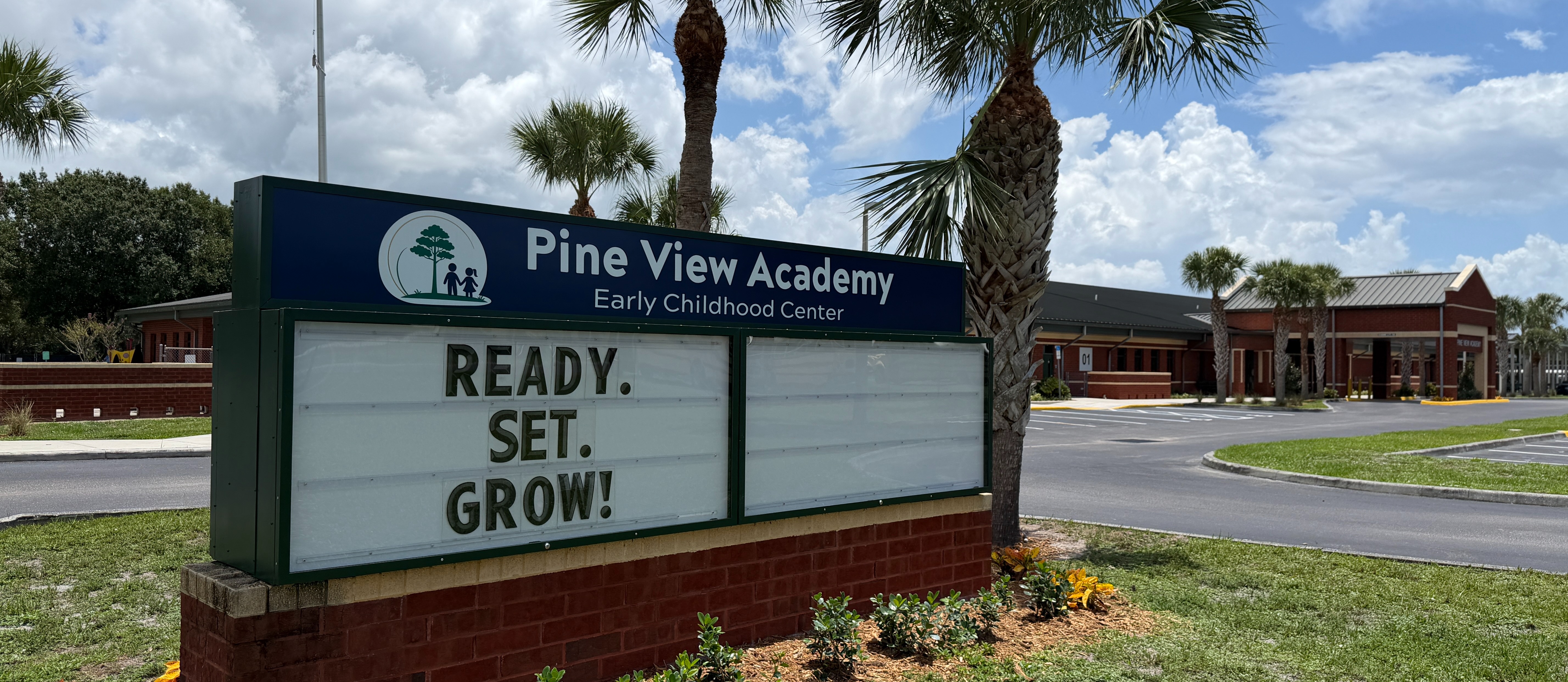 Pine View Academy sign and front of school