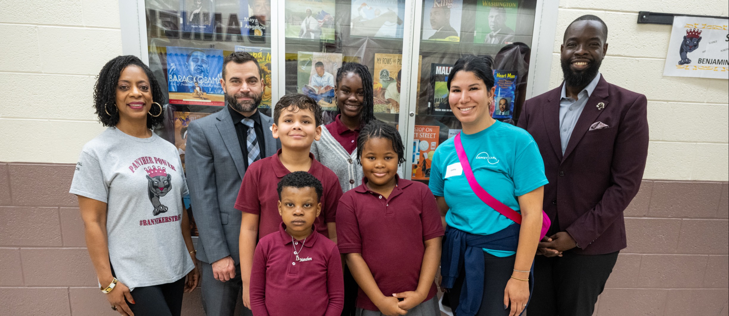 Dr.Burton alongside students, jersey care group photo