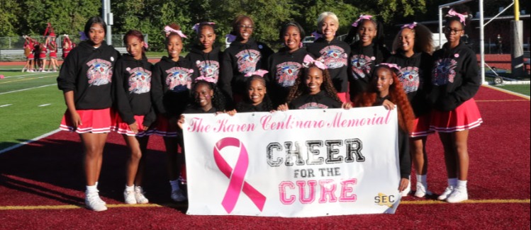 East Orange Cheer team group photo at Cheer for Cure Showcase