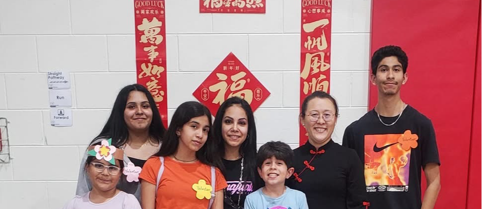 students gathered with Ms Ding for AAIP month