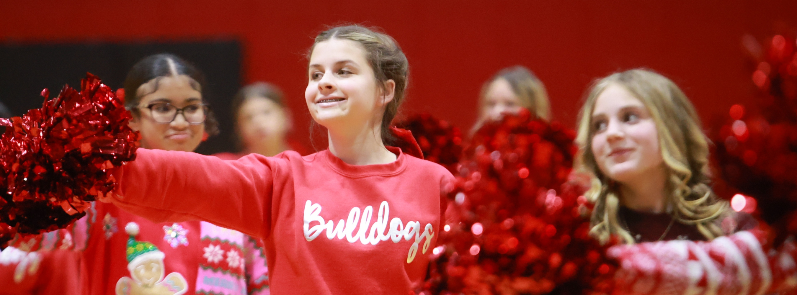 Boiling Springs Middle School cheerleaders are doing cheers.