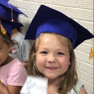 Young student wearing graduation cap