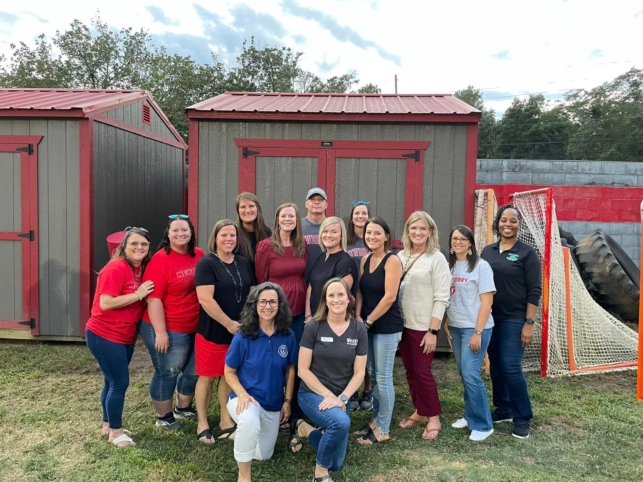 Before the game, the Teacher Forum hosted a tailgate to celebrate the Teachers of the Year. Pictured with school Teachers of the Year are several former District Teachers of the Year.