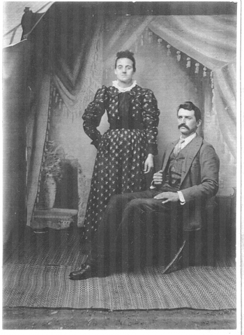 A black and white photo of the founder of the school, Jame Oliver Elmore, along with his wife.