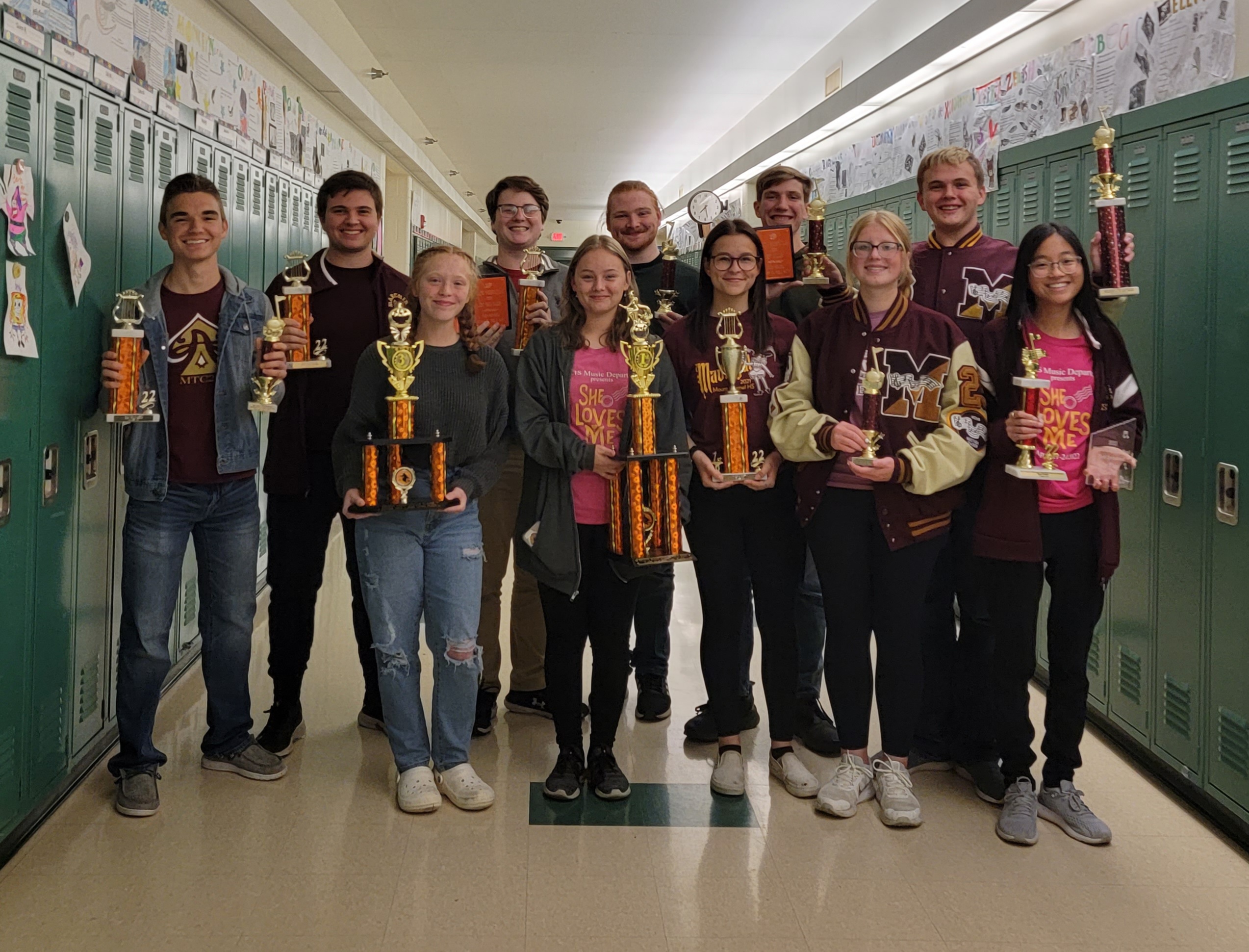 Senior Band Kids with trophies from the season