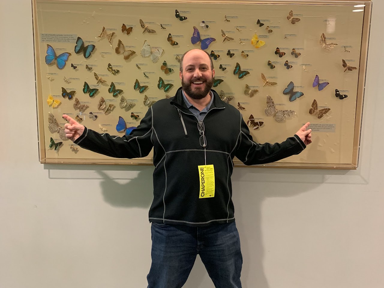 Mr. Todd Segar in front of display of butterflies