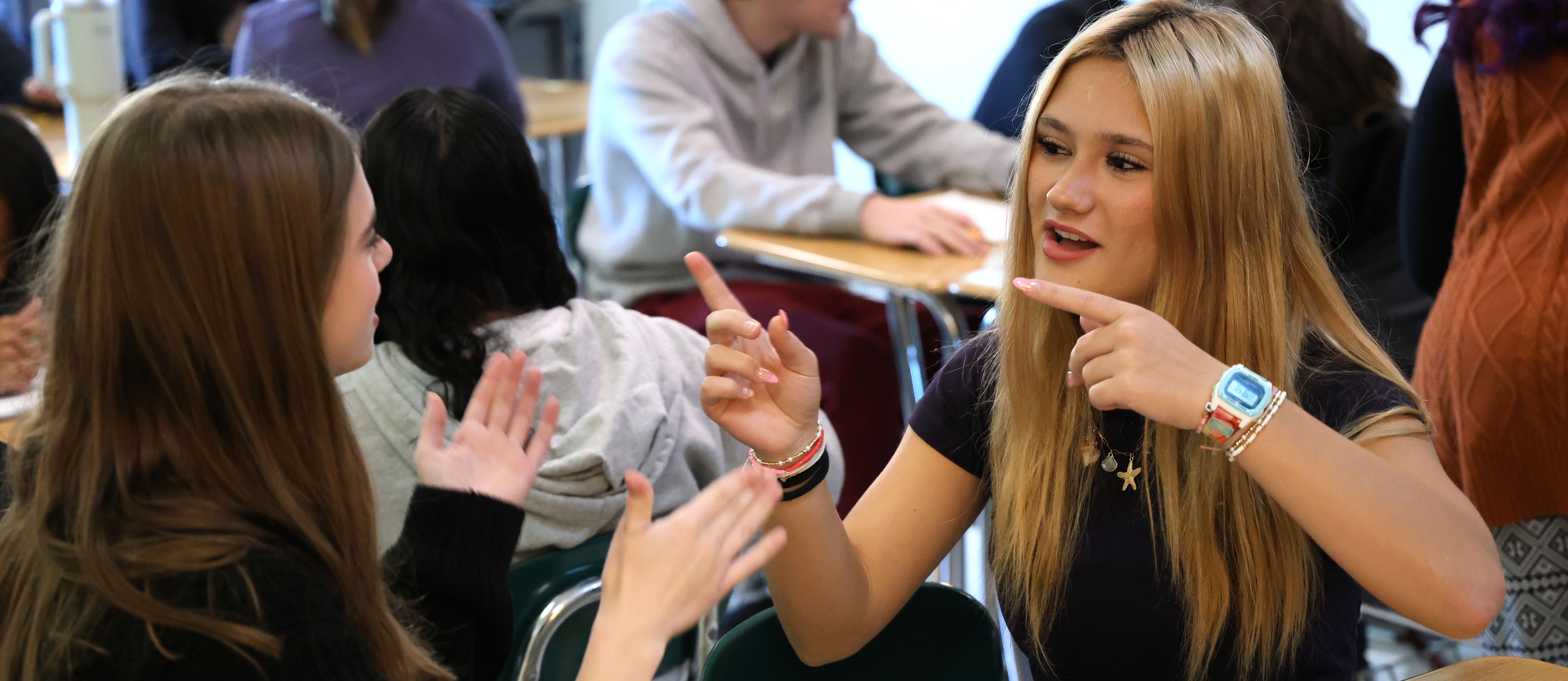 Indian River High School students practicing American Sign Language