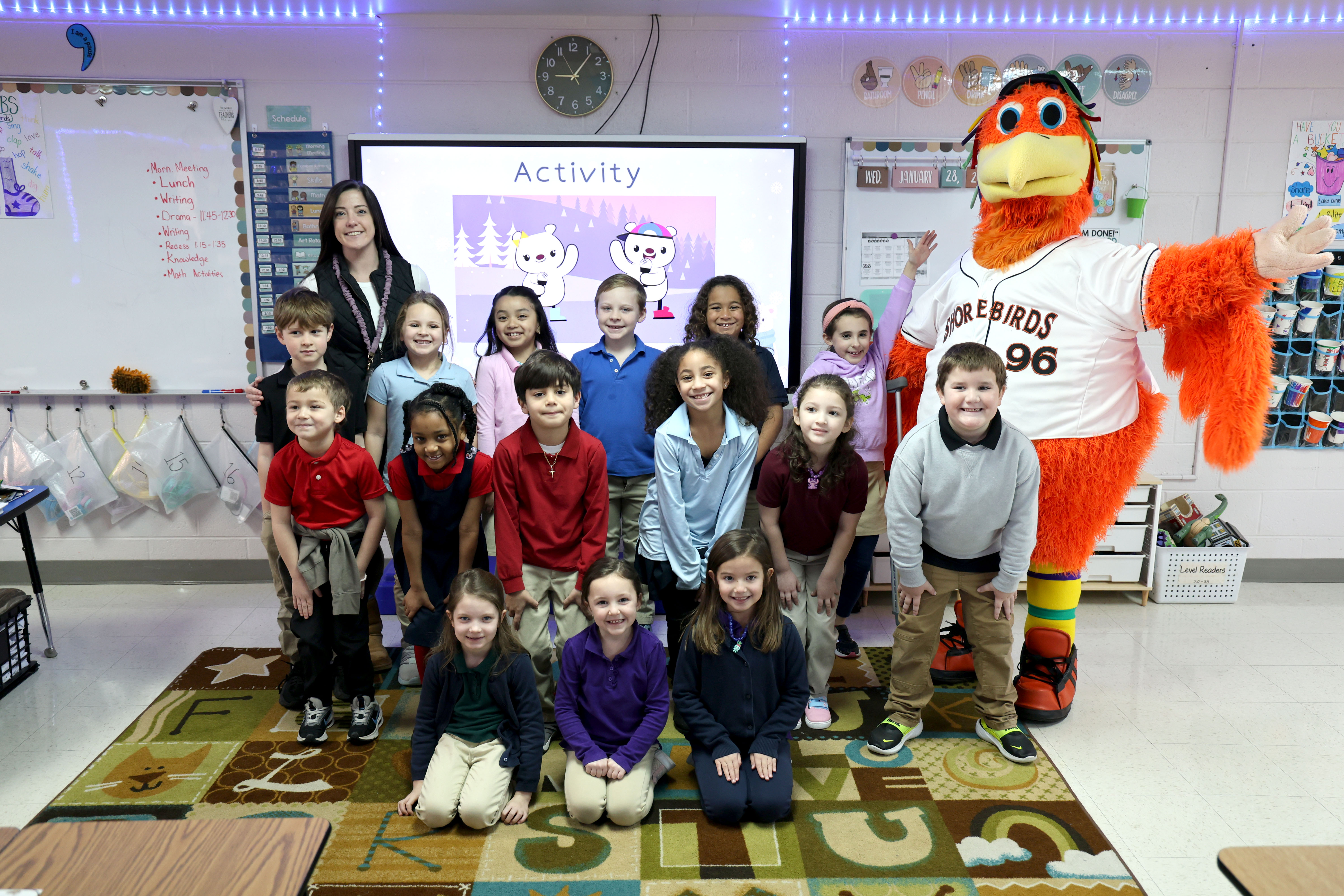Students posing with Shorebirds mascot