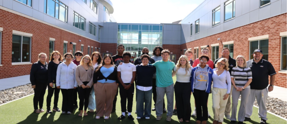 students and staff smiling