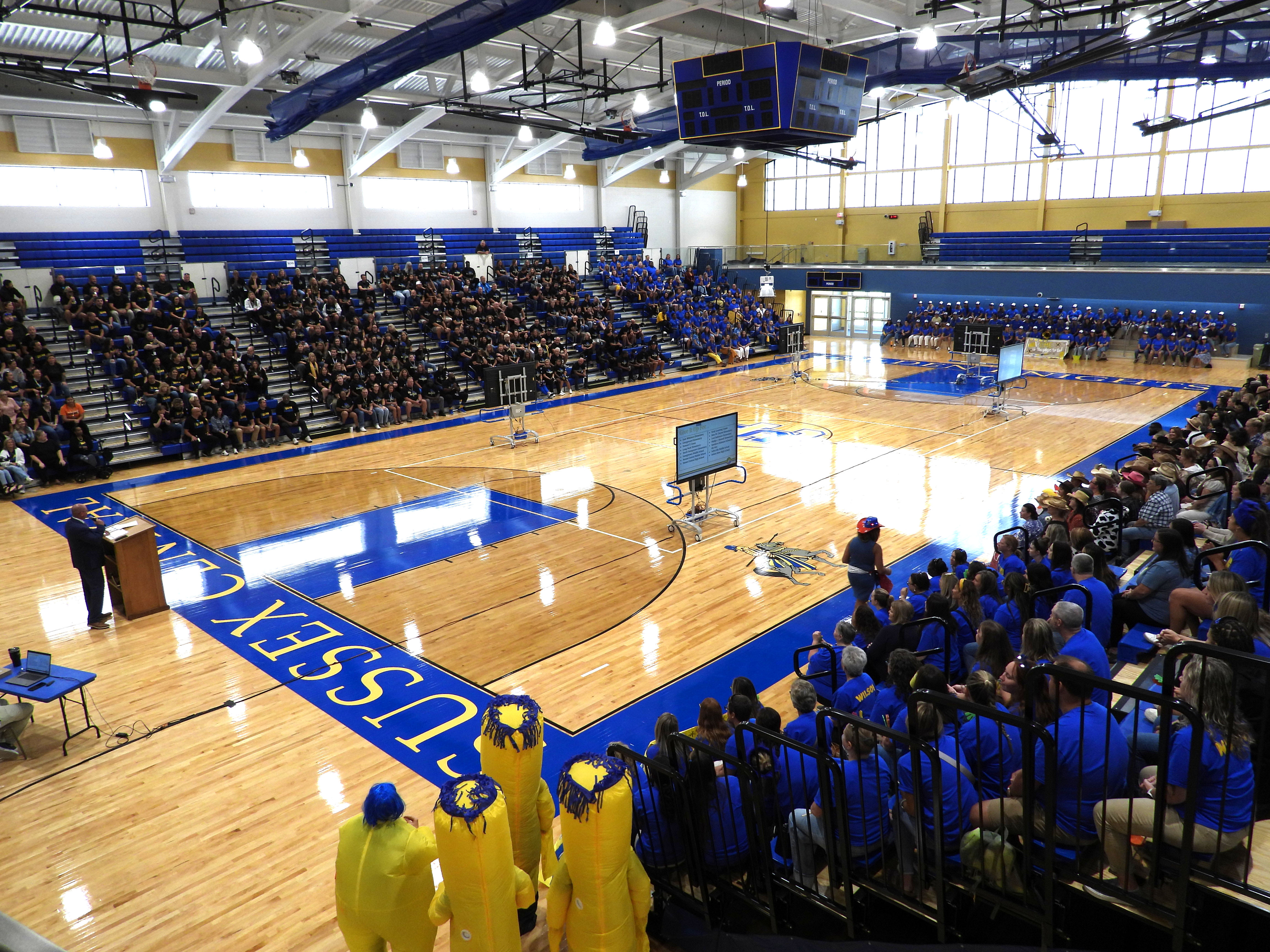 Sussex Central High School's gym with bleachers full of staff