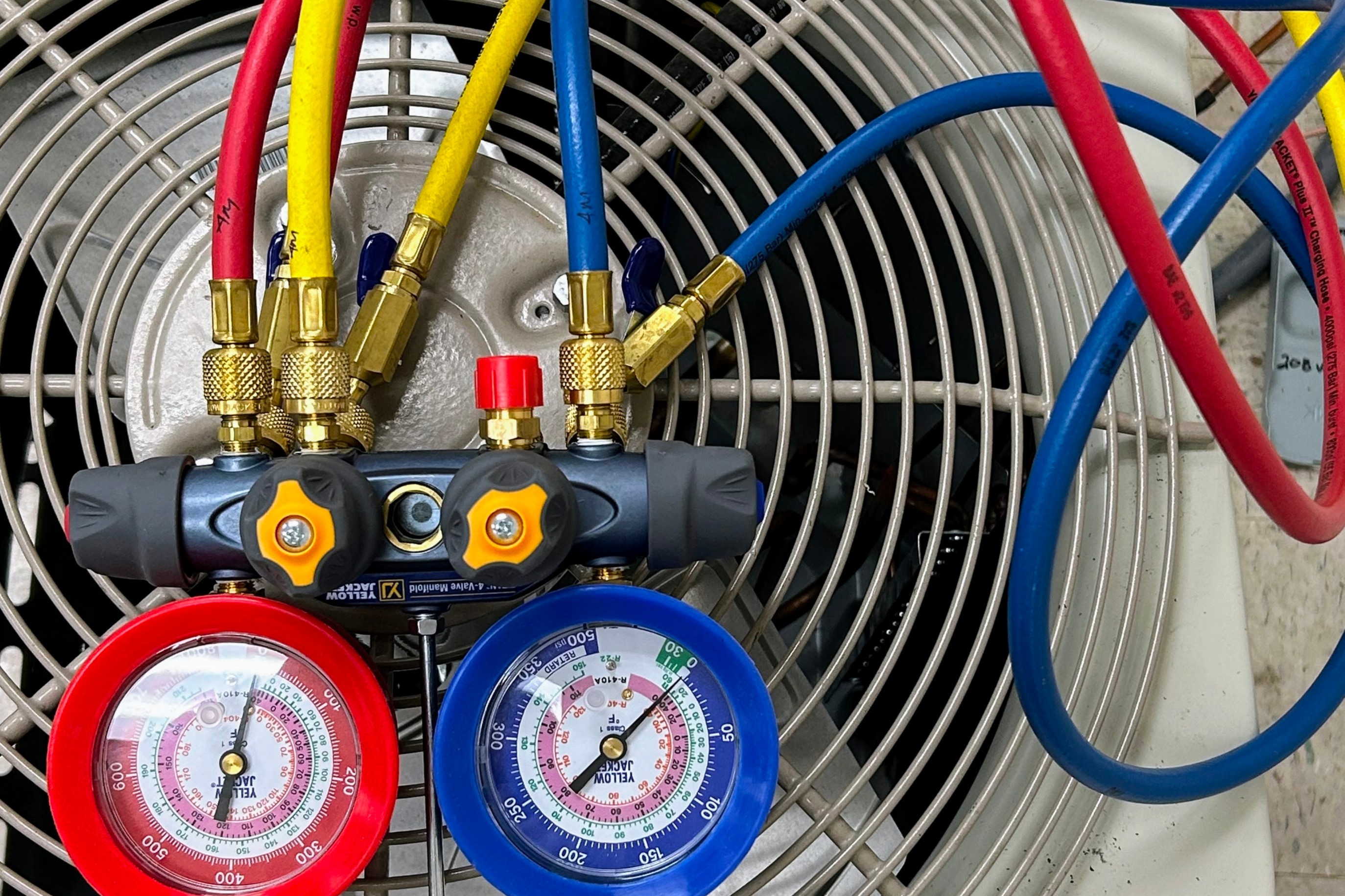 Refrigerant guages on an air conditioning unit.
