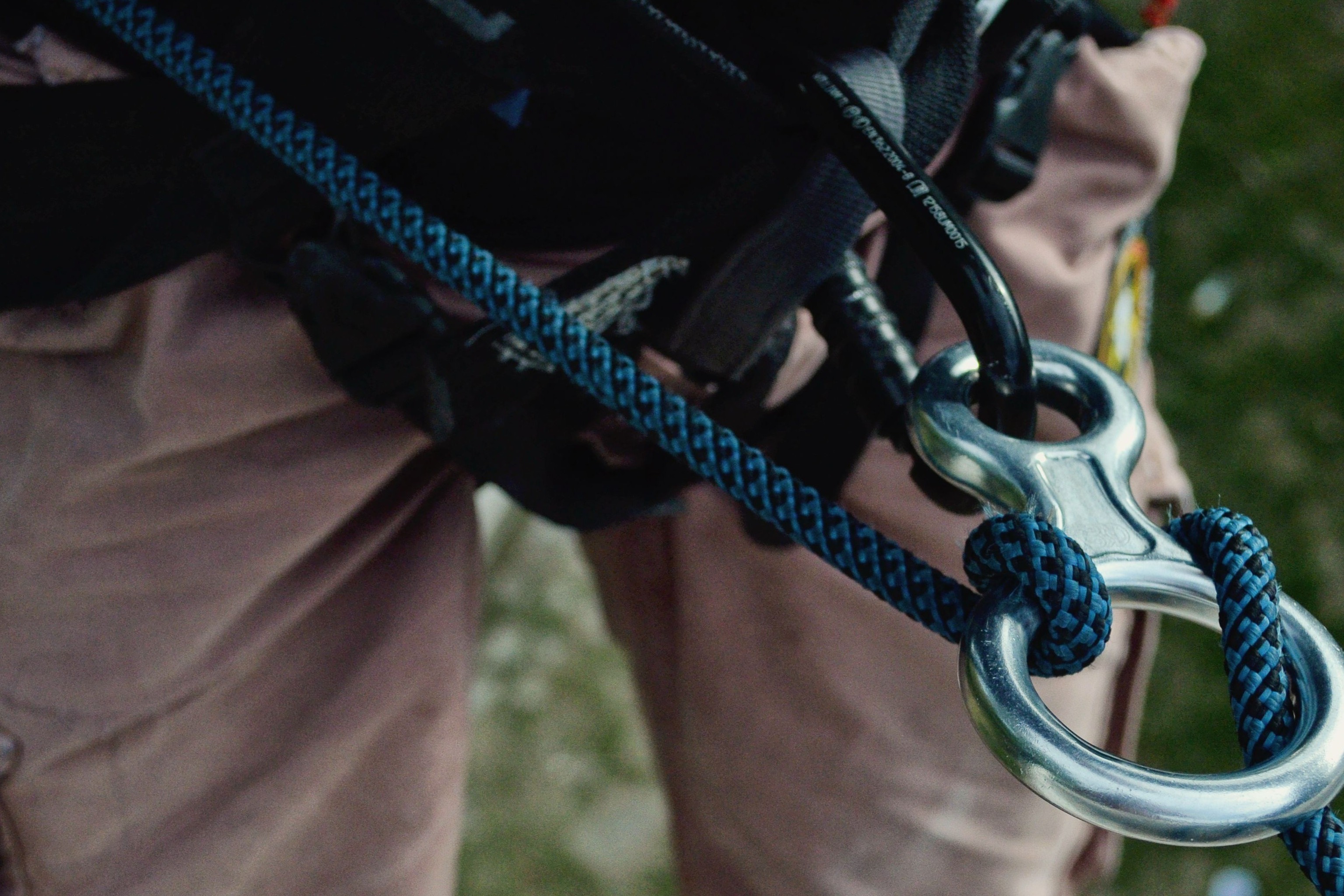 man in harness with rope