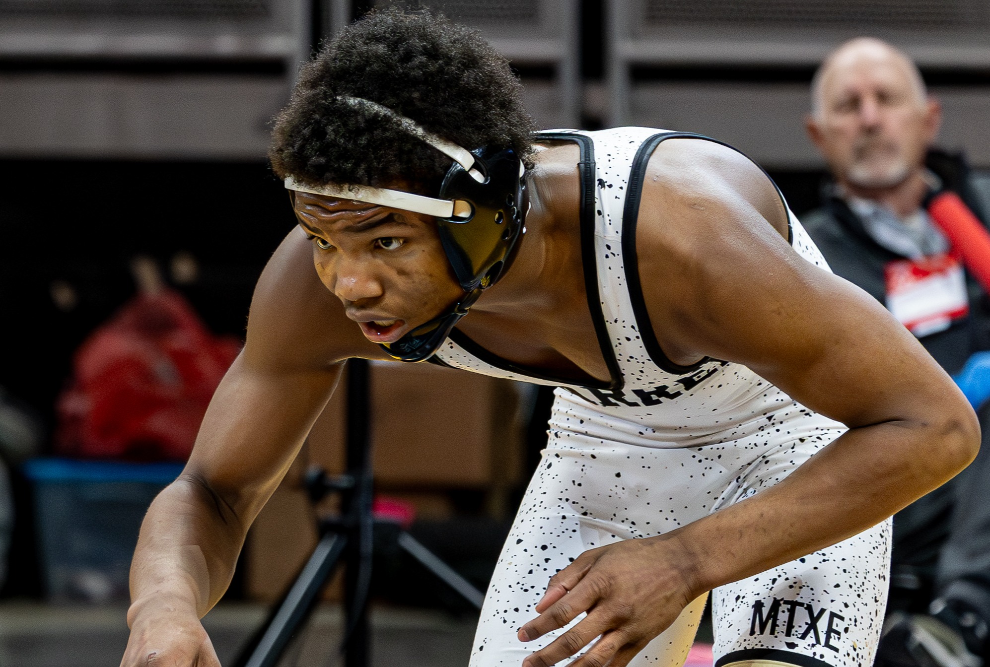 Student wrestling in the State Finals match