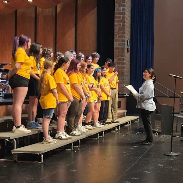 CNH and CHS choir on stage