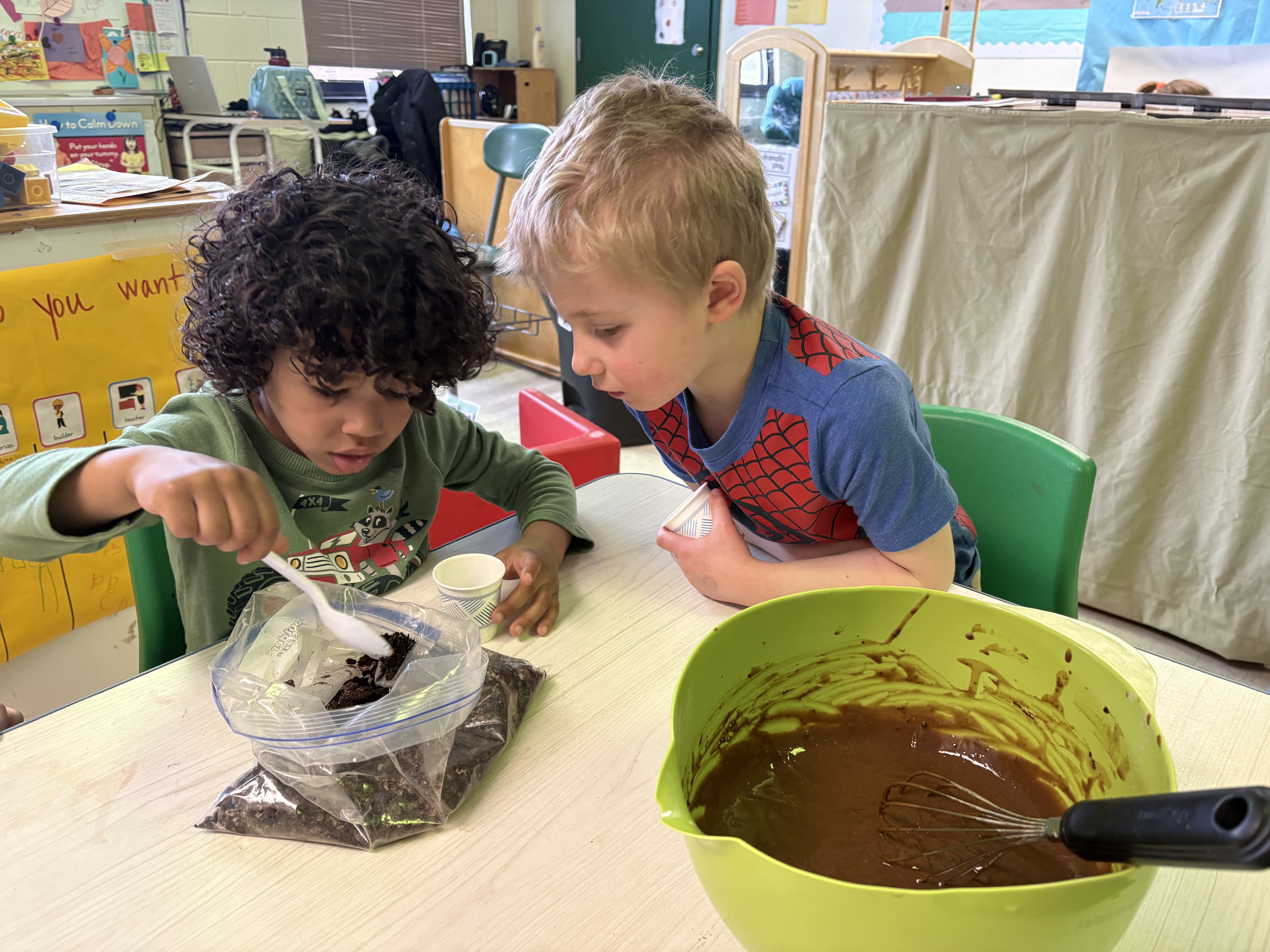 2 students working on project at table