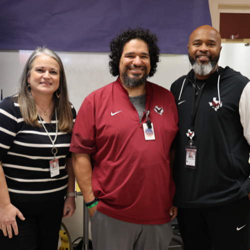Staff Members Smile for a Picture