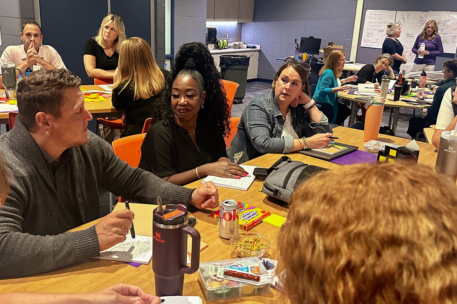A group of FPS educators sitting around a table at an educator workshop