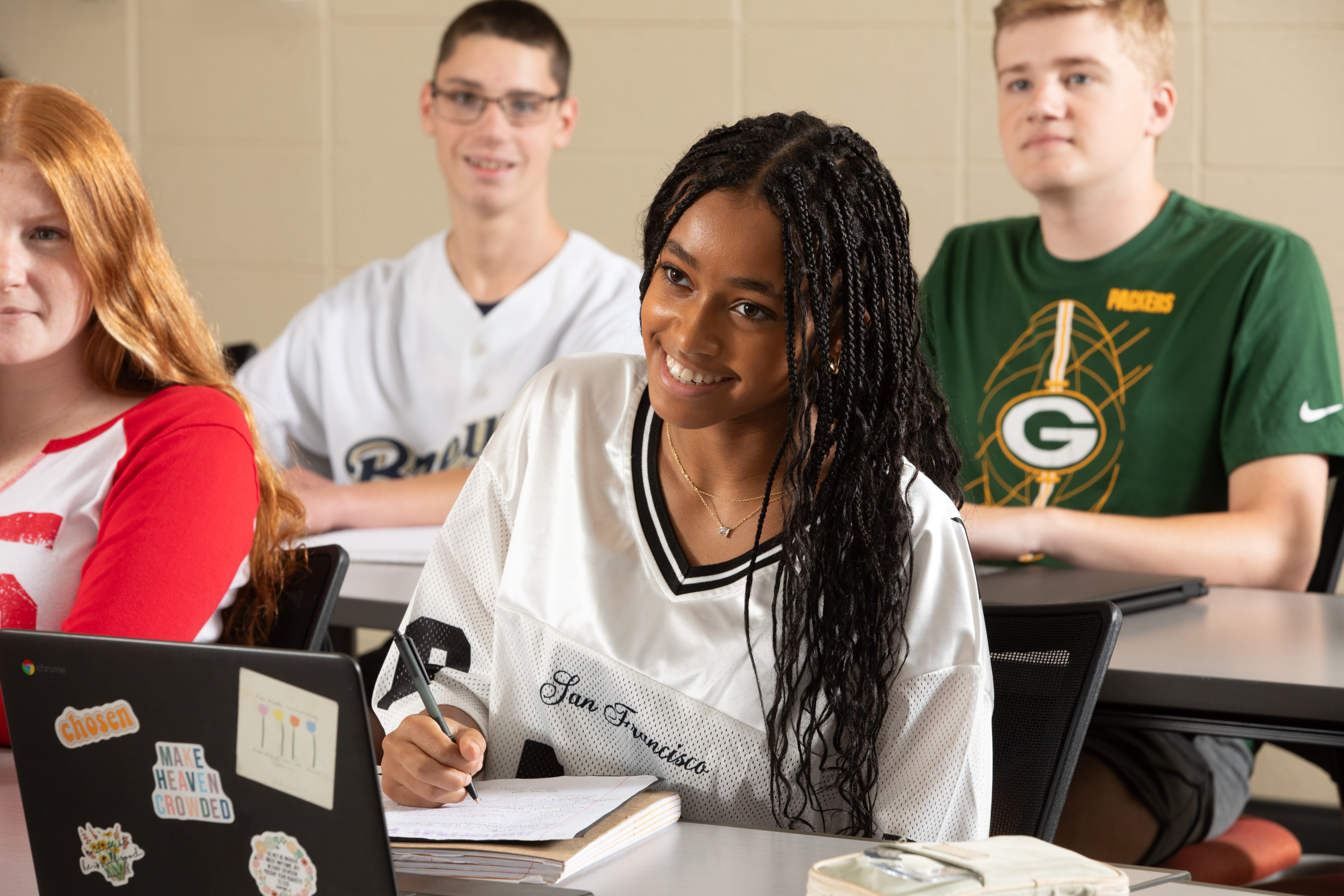 Students sitting in classroom listening to instruction