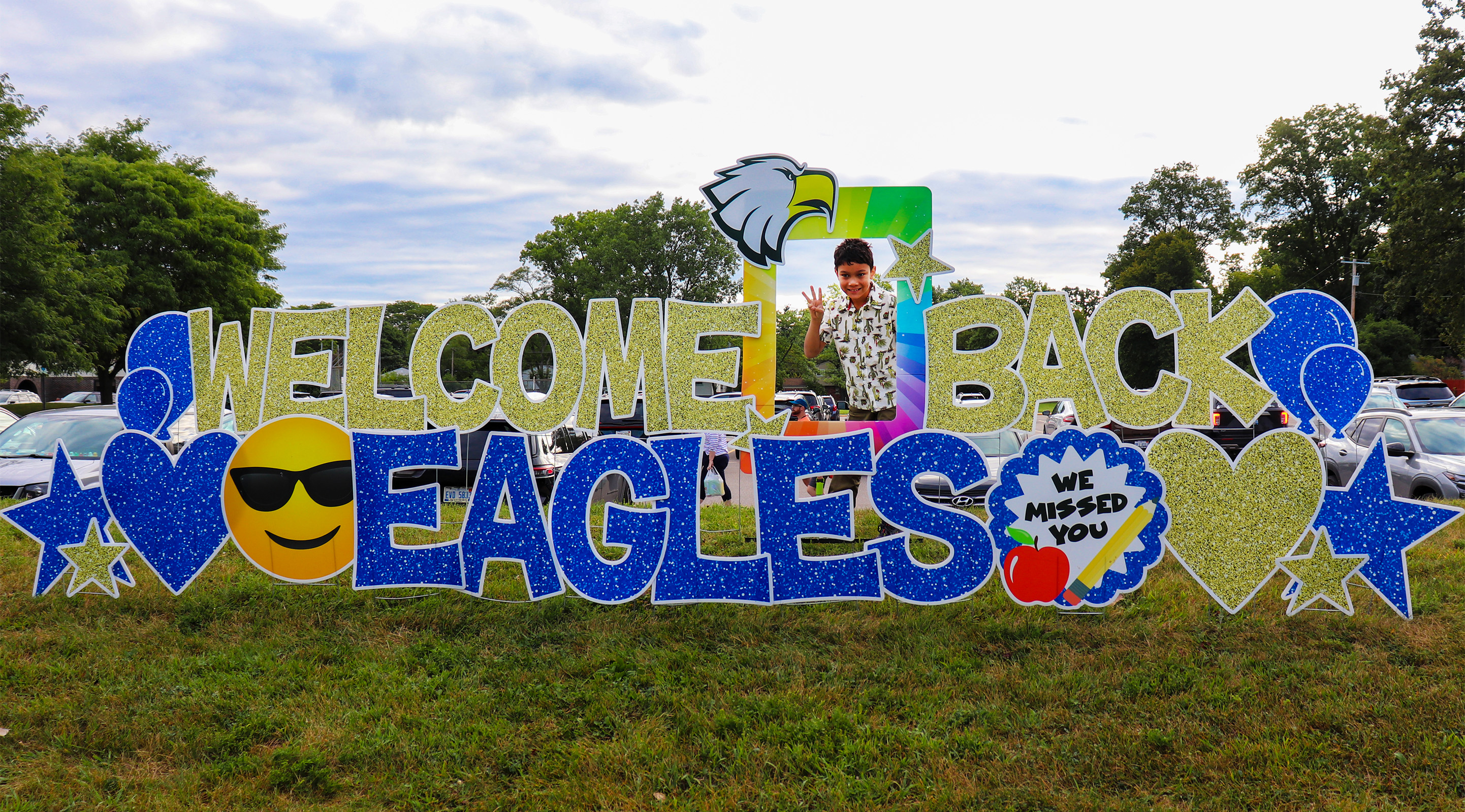A sign in the yard that says Welcome Back Eagles
