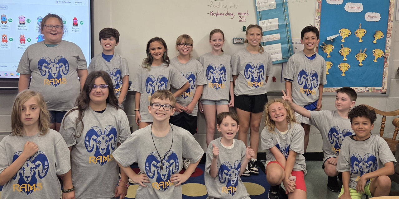 A group of students from Stewartstown Elementary posing in their RAMS Tshirts.