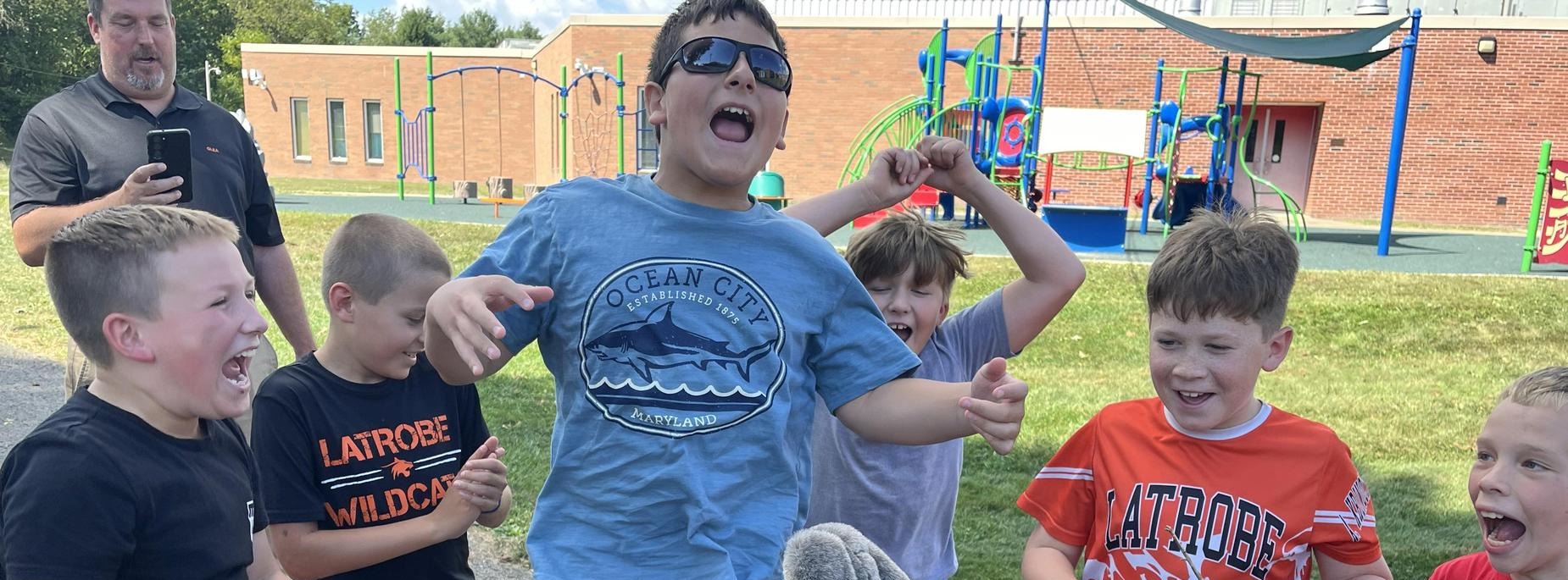 students and staff on playground