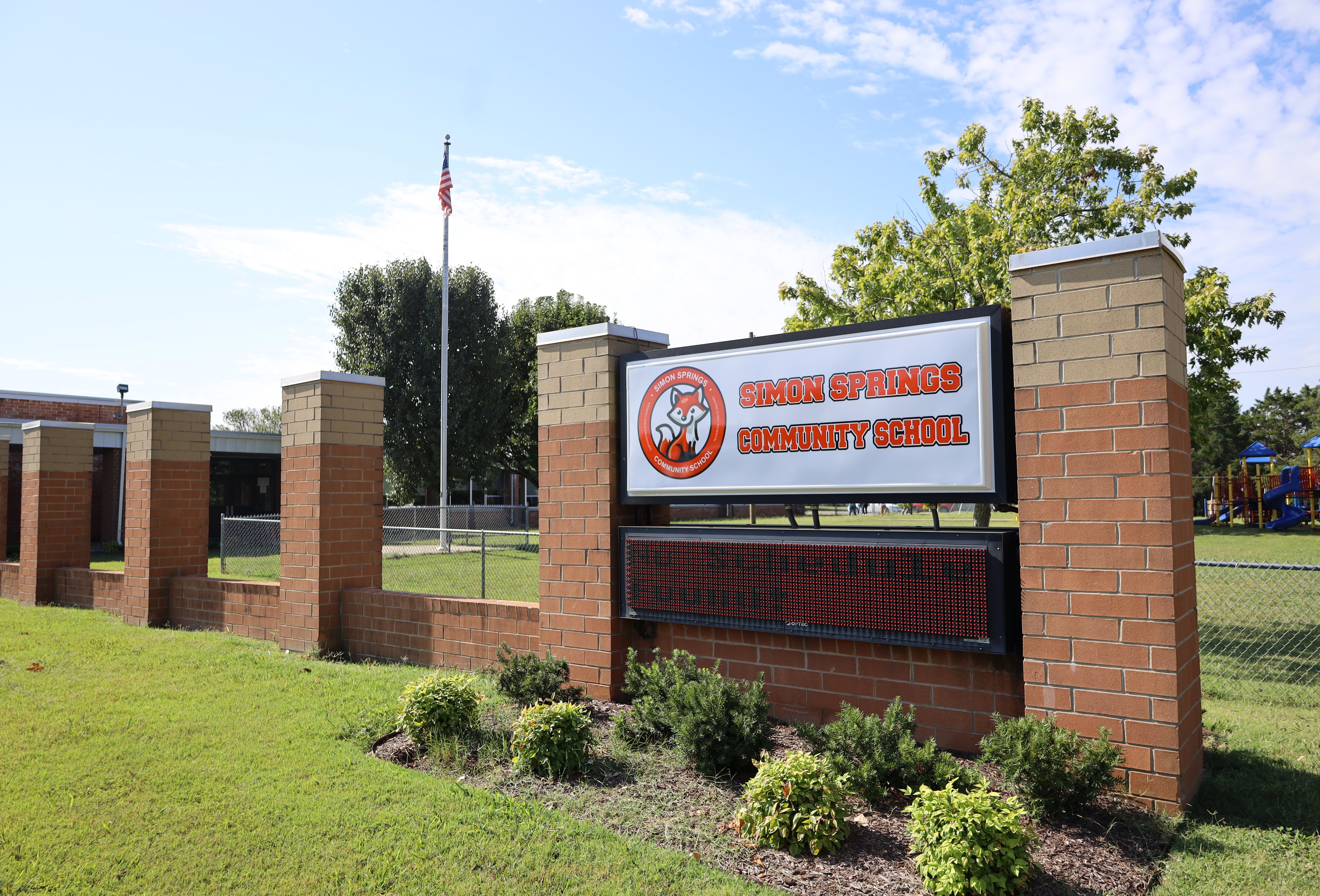 Brick sign with Simon Springs Elementary School in orange letters