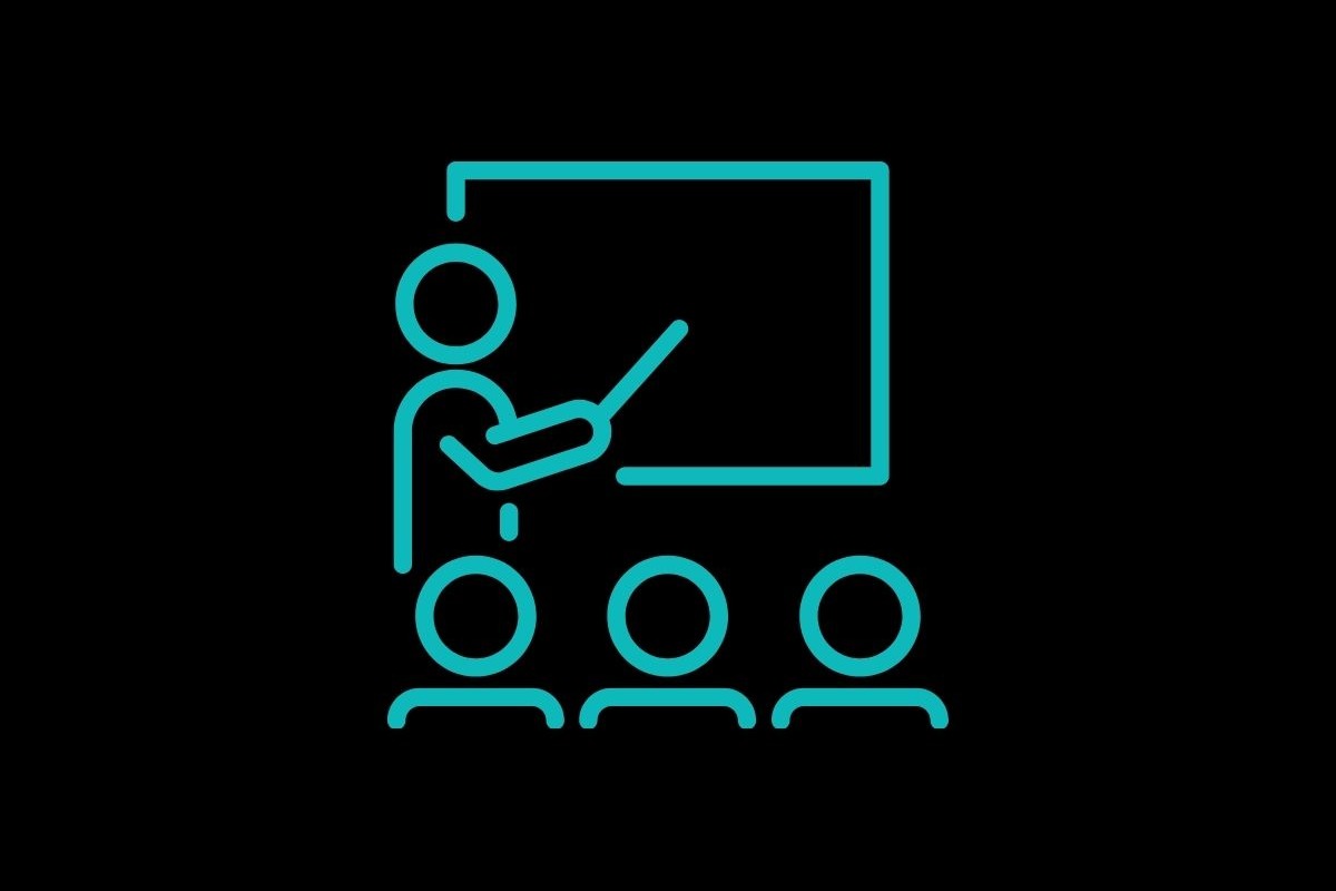 Line drawing of a teacher at a blackboard with three students seated in front.