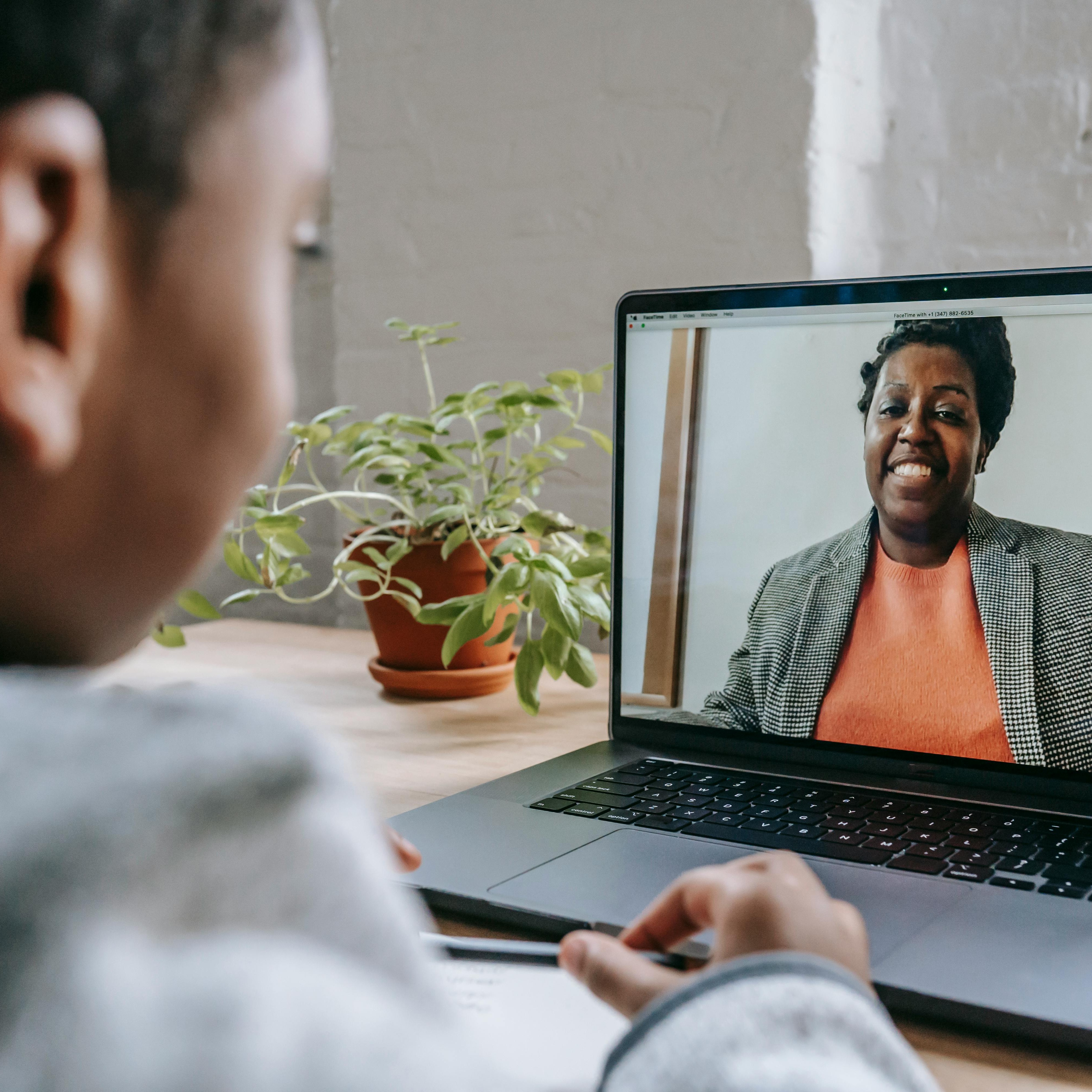 Teacher on computer in a virtual class