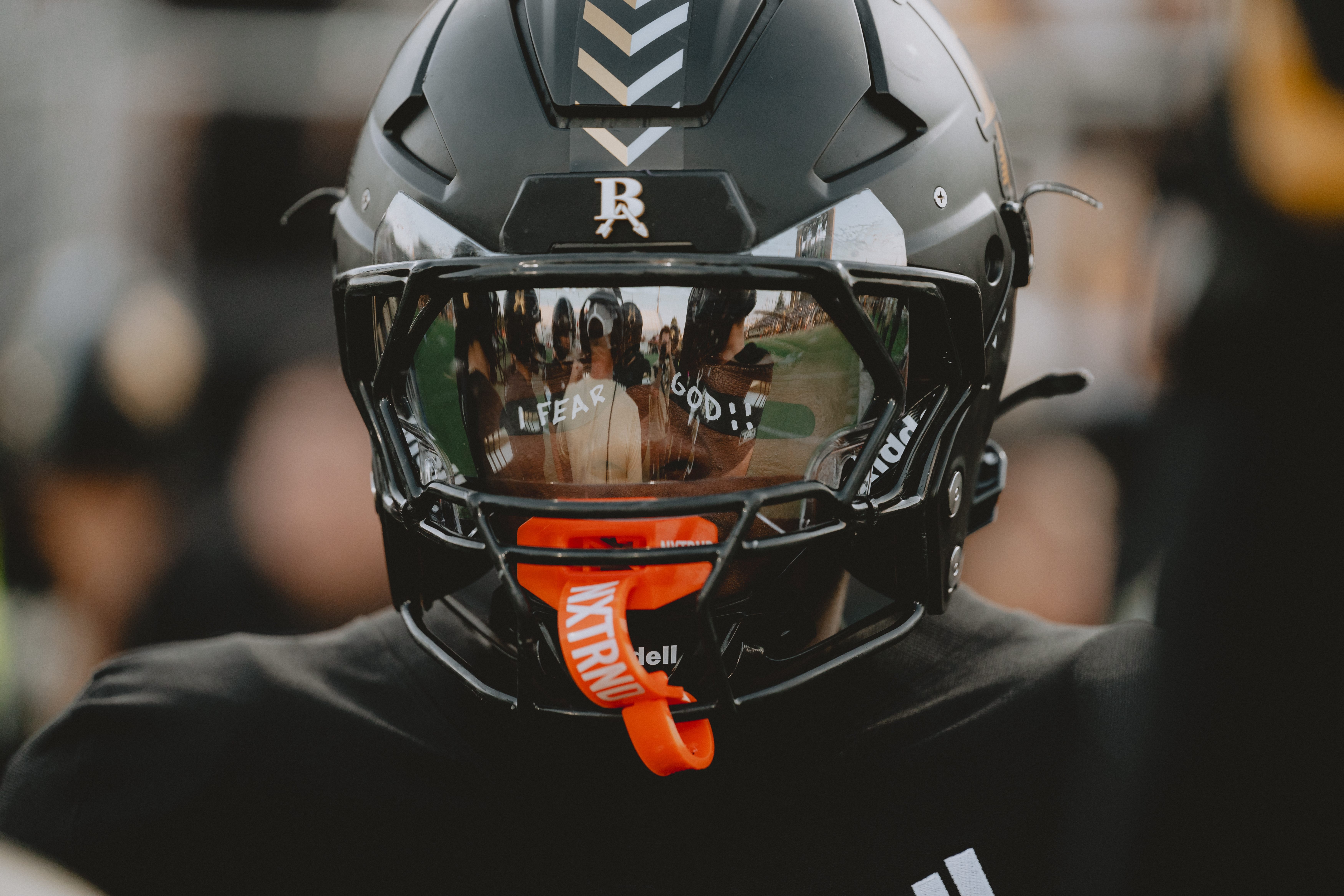 Football player with helmet on 