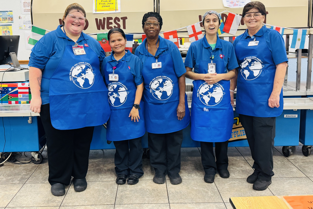 school food service workers posing for photo