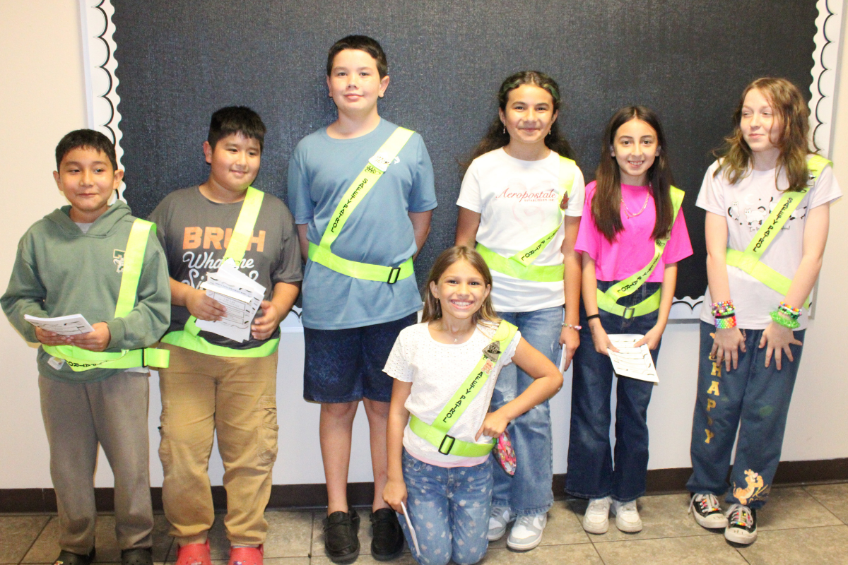 group of safety patrol students posing for a picture